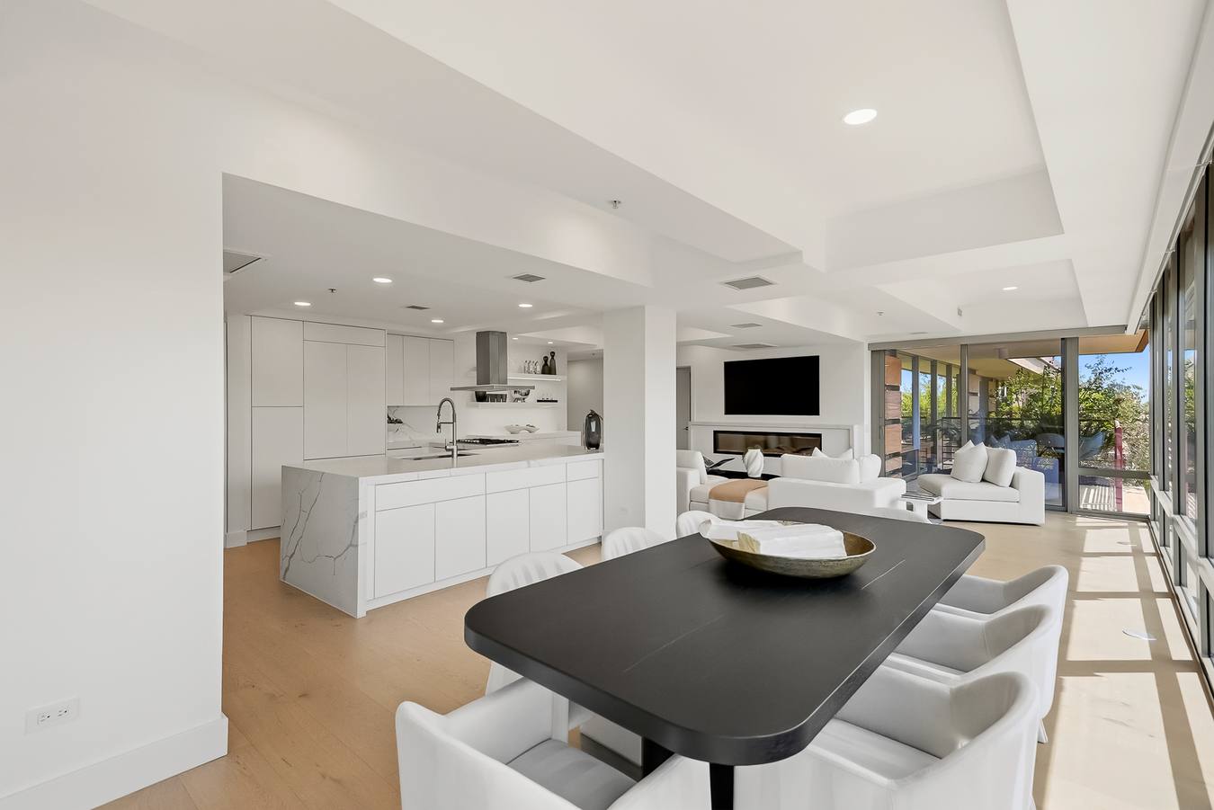 Open-concept kitchen, dining and living
